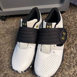 Under Armour Kids' White and Black Sneakers with Gold Accents